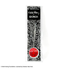 Load image into Gallery viewer, Keith Haring art with red angel printed on round clear acrylic pendant filled with black liquid