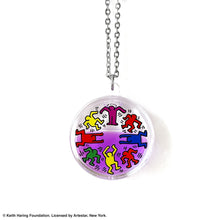 Load image into Gallery viewer, Keith Haring art with eight dancing rainbow men printed on round clear acrylic pendant filled with purple liquid