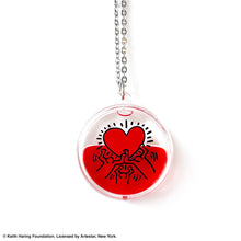Load image into Gallery viewer, Keith Haring art with three men holding up red heart printed on round clear acrylic pendant filled with red liquid
